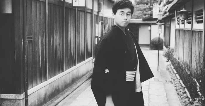 japanese young man looking confident walking city