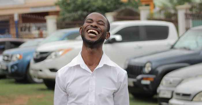 japanese man laughing confident outdoor carefree