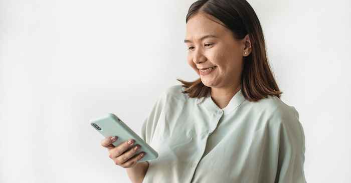 japanese woman looking phone smile happy