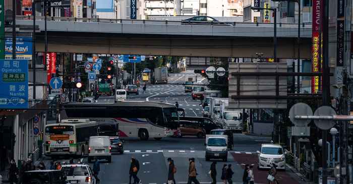 japanese man standing street looking confident busy crossroad