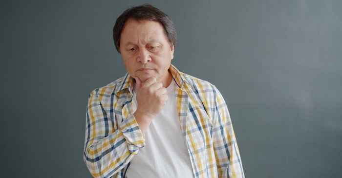 japanese man thinking carefully making decision serious
