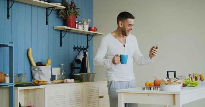 japanese young man smartphone smiling happy new start